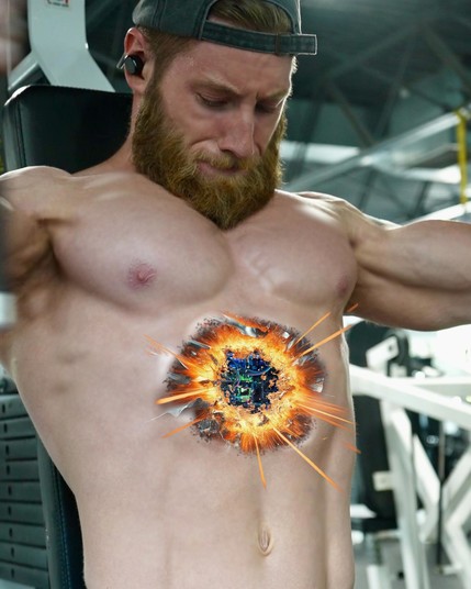 A muscular male android is in the middle of a shirtless pec fly when his abdomen erupts with a fiery blast, showing circuitry underneath the torn skin