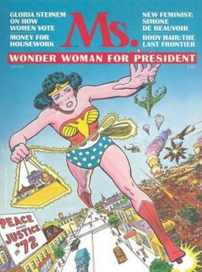 The cover of Ms Magazine number 1. It suggests Wonder Woman for President, with an illustration of a giant version of the superhero walking down an American street.