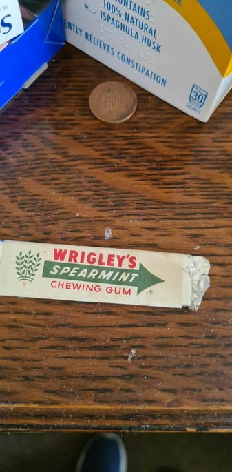 An individually wrapped stick of wrigley's spearmint chewing gum, in a style that hasn't been available in decades. 