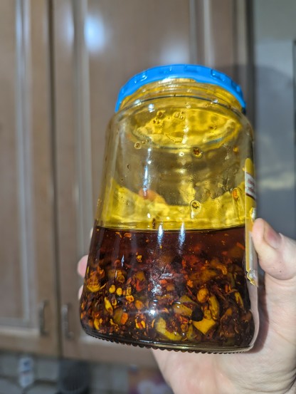 Photograph of a homemade jar of chili crisp