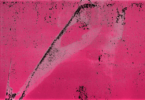 A piece of badly damaged film: in a pink-red field the swath of dark and light damage resembles, to me, a plague mask or the head and eye of some great avian monster.