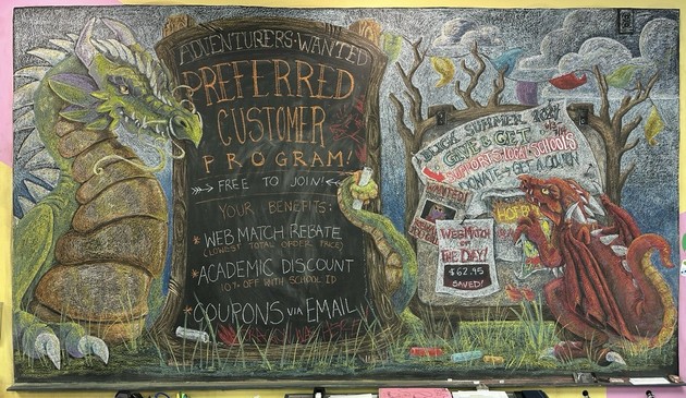 Colorful chalkboard drawing featuring two dragons, a green one on the left and a red one on the right, promoting a "Preferred Customer Program."