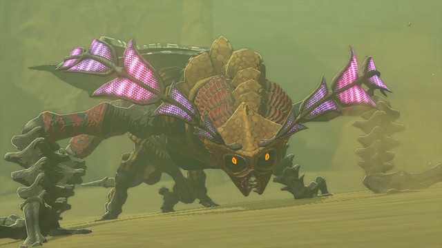 Tears of the Kingdom Screenshot: Queen Gibdo monster in the desert, with its antennae lit up purple. 