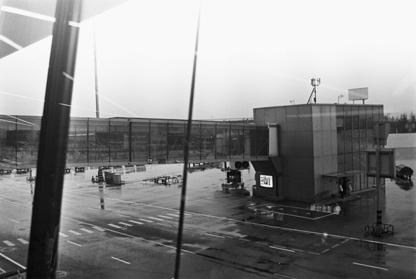A black and white image of a jet bridge