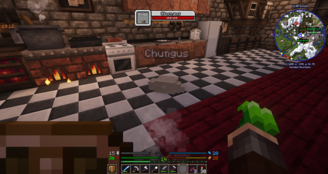 Screenshot of Minecraft. In the foreground, a kitchen with black-and-white checkered flooring, and several cooktops, cabinets, a cooking pot, and an oven. A fat silkworm named Chungus is slithering on the floor.