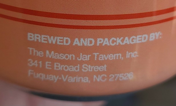Photo of a can, 
Brewed and packaged by:
The Mason Jar Tavern, Inc.
341 E Broad St.
Fuquay-Varina, NC 27526