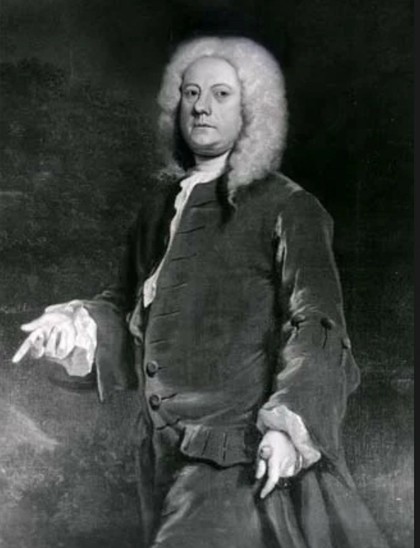 A historical portrait of a person in 18th-century attire with a white curly wig, formal coat, and elaborate shirt sleeves, set against a dark background.

This is Juthro Tull, an English agriculturist perfected a horse-drawn seed drill in 1701 that economically sowed the seeds in neat rows, helping to bring about the “British Agricultural Revolution of the 18th century”.

https://en.m.wikipedia.org/wiki/Jethro_Tull_(agriculturist)

https://www.britannica.com/biography/Jethro-Tull