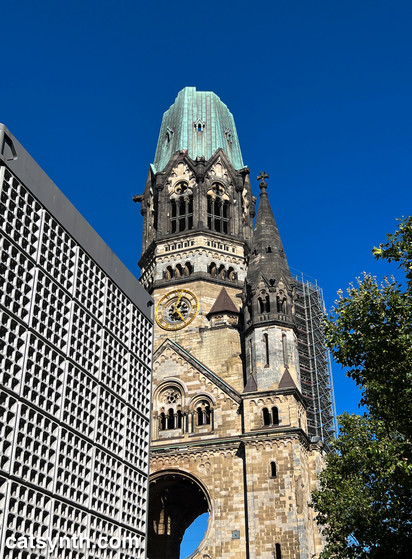 Ruins of a bombed out church next to a modern extersion