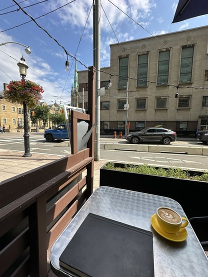 On the patio of Versus at Adelaide and Church; the spire of St. James Cathedral peeks out in the background 