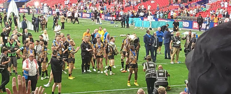 Leigh Leopards with the Challenge cup on the pitch at Wembley Stadium 