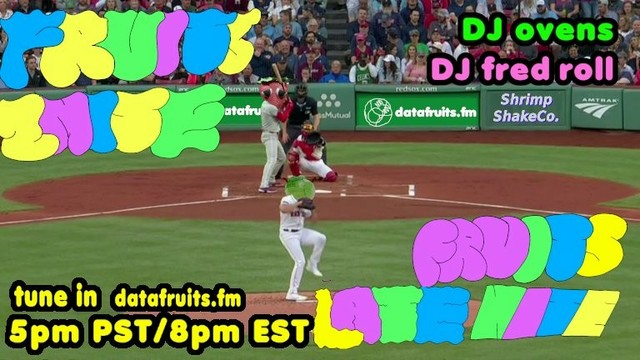 screenshot of a baseball game where the pitcher has lifted his leg and is about to throw the ball. his head has been replaced by the cabbage from datafruits, and the batters head has also been replaced by strawbur. the text reads FRUITS 2NITE and FRUITS LATE NITE in a large hand-written design by freedrull. Additional text says it's DJ ovens and DJ fred roll. tune in datafruits.fm 5pm PST/8pm EST