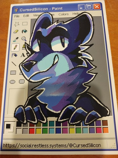 BigAssed sticker from CursedSilicon. It's the MS Paint interface with a blue furry breaking the forth estate popping through.