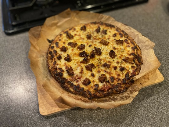 Sausage pizza on a cauliflower pizza crust 