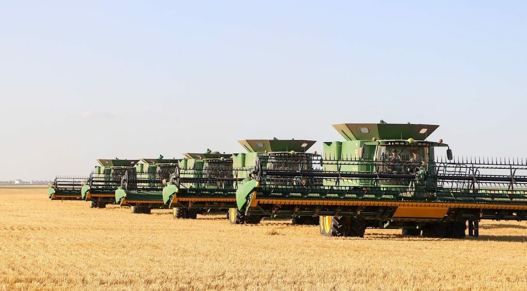 Custom harvest crews form a tight knit group - travel the country for months. Five custom cutters in John Deere combines