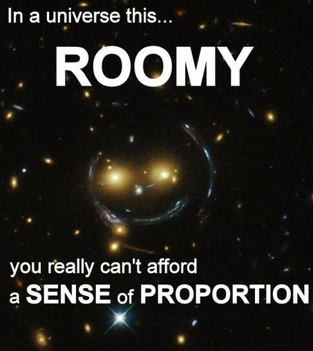 Image:  galaxy cluster SDSS J1038+4849 distorted by gravitational lensing into the semblance of a smiley face.
Meme caption: 