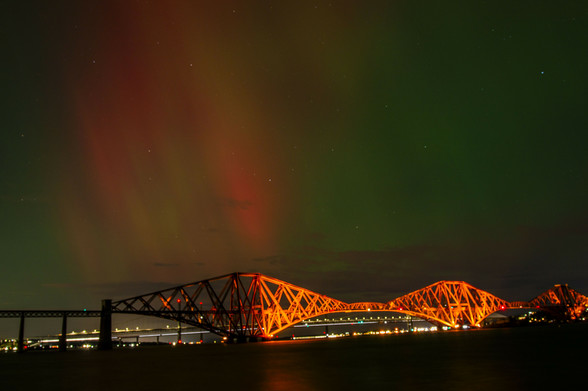 Red and green aurora over the Forth Rail Bridge