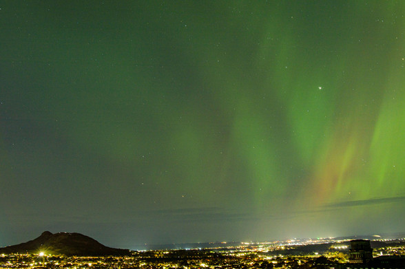 Green and orange aurora over Arthur's Seat, Edinburgh