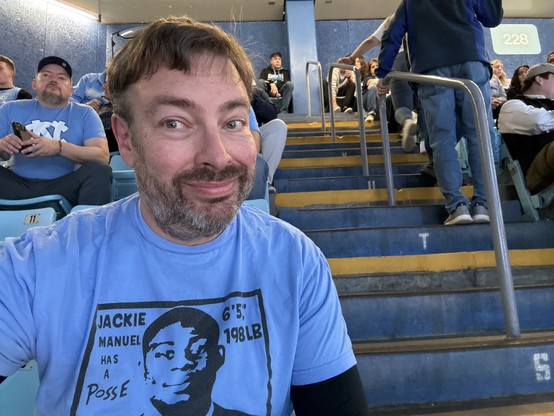 Michael in section #228A of the Smith Center sporting his Jackie Manuel has a posse t-shirt in honor of the American University coach.  #goheels 