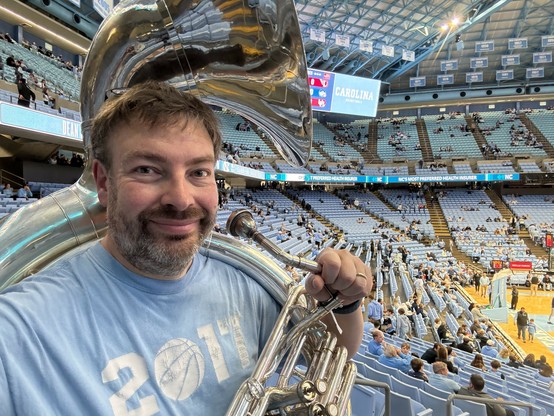 Michael getting ready to play #sousaphone in the #alumniband for today’s basketball game in Chapel Hill #goheels