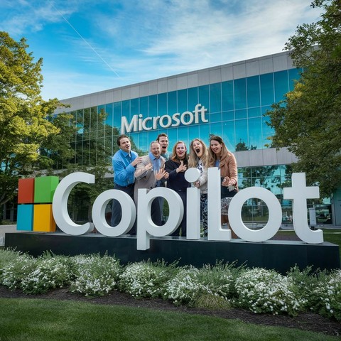 Microsoft Redmond HQ with a Copilot logo.
