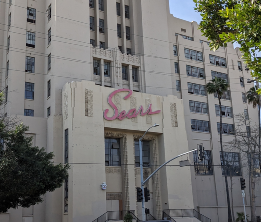 Old cursive street style Sears sign.
