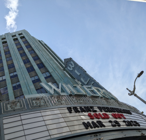 Wiltern signs, tower and clouds.