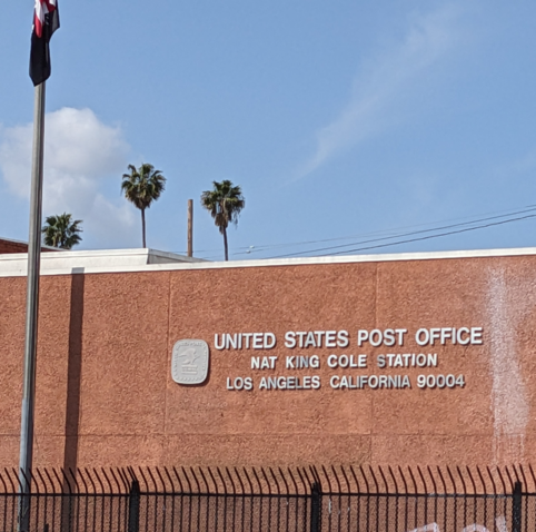 Sign for the Nat King Cole station of the USPS.