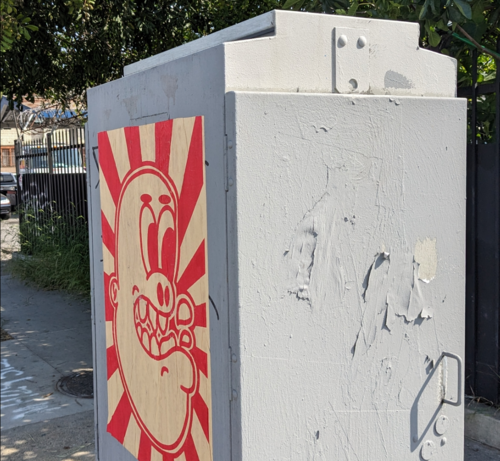 Poster on a utility box with an image similar to goblin graffiti I've seen