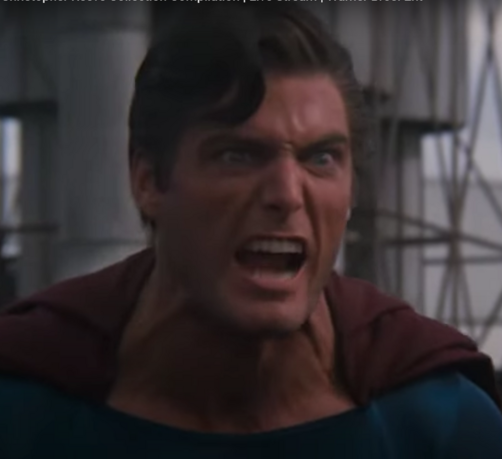 Superman 2 Superman vs Clark Kent Scene.

Christopher Reeve is wearing a darkened version of his suit growling at the camera, veins popping out of his neck, still in in a junk yard.
