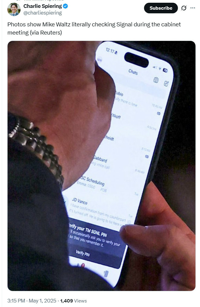 A close up of a phone screen with hands holding it, showing Signal with the "Verify your PIN" pop up and an assortment of conversations with top US government officials like Tulsi Gabbard, Marco Rubio, and JD Vance. If someone wanted to make a joke screenshot it would look like this, but it's a real photo from Reuters and I want to get off this timeline