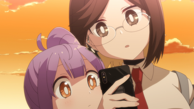 two girls looking at a phone screen