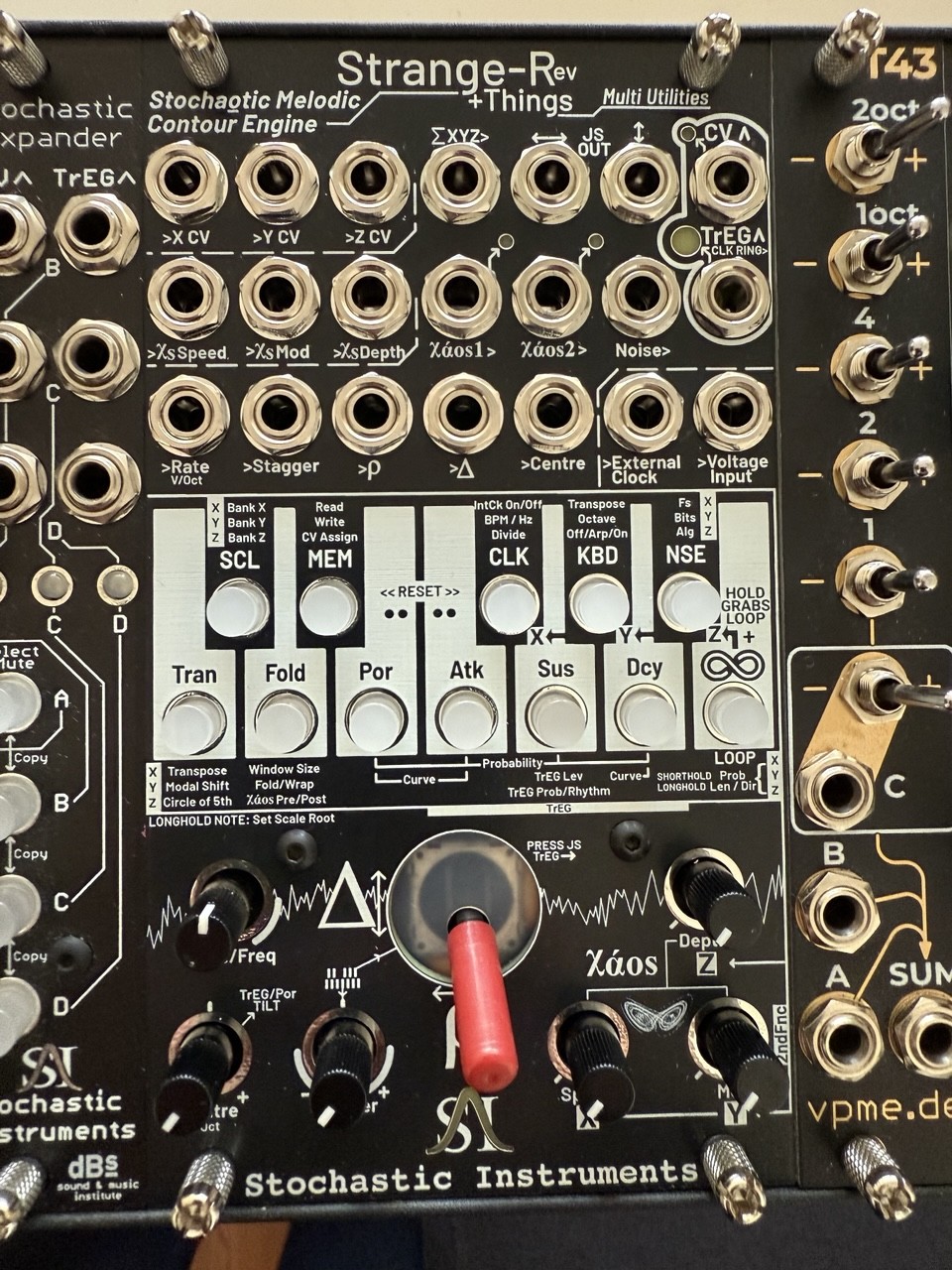 A Eurorack module called Strange-R, by Stochastic Instruments, 14hp wide, with 21 jacks, six trimmers, a small joystick, and a one-octave button keyboard with each button doing up to triple auxiliary duty. It generates a melodic line with a highly-controllable and quantizable random walk, plus associated trigger-envelopes and the possibility of modal rotations and cycle-of-fifths transpositions, plus a whole lot more. Going to take a while to grasp it all. A Eurorack module called Strange-R, by Stochastic Instruments, 14hp wide, with 21 jacks, six trimmers, a small joystick, and a one-octave button keyboard with each button doing up to triple auxiliary duty. It generates a melodic line with a highly-controllable and quantizable random walk, plus associated trigger-envelopes and the possibility of modal rotations and cycle-of-fifths transpositions, plus a whole lot more. Going to take a while to grasp it all.