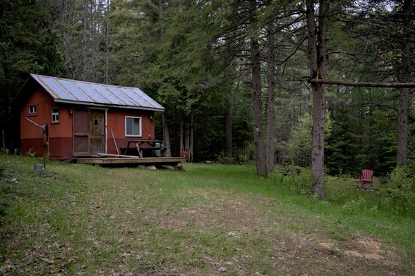 A hunt camp in the woods.