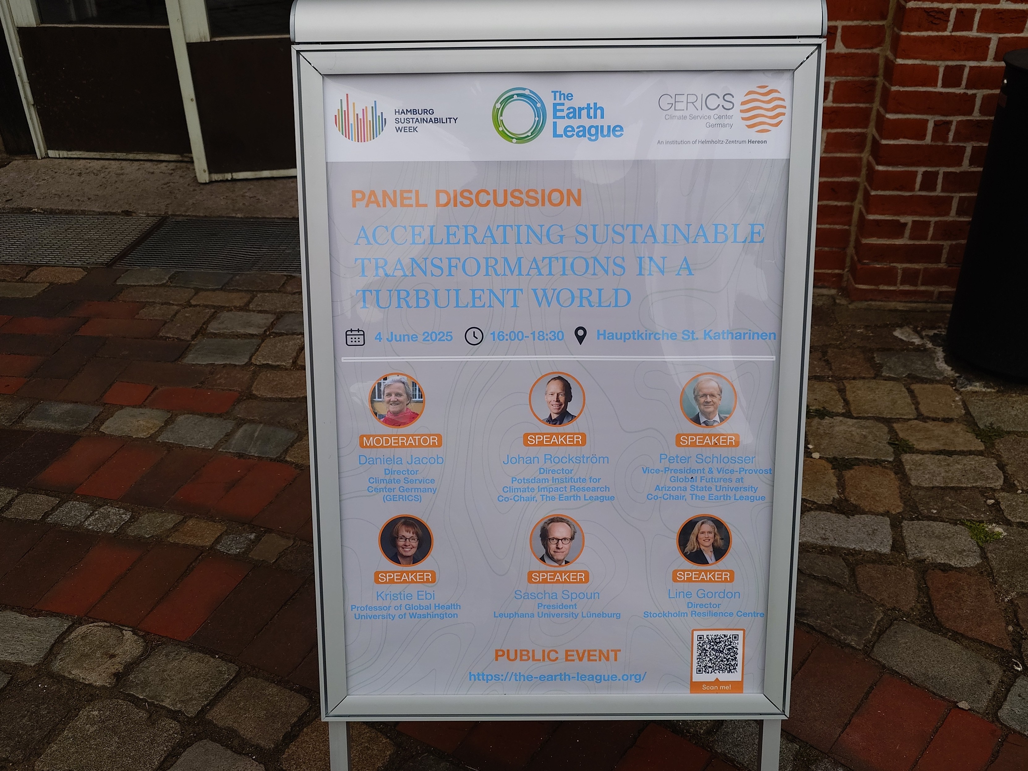 A poster for the event announces the title and the speakers.