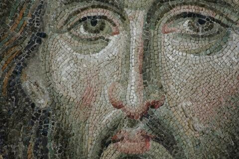 A closeup of a mosaic apparently depicting Christ.