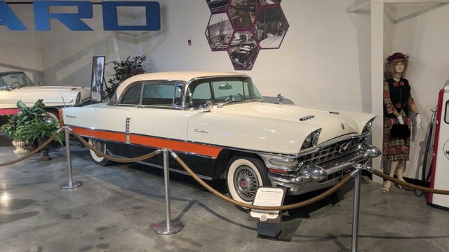 A white orange and black three tone vintage auto.