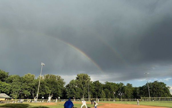 A baseball game with a double rainbow. The game was delayed an hour because of light rain and lots of lightning. Then once they started playing the game was delayed by lots of walks in the top of the 1st inning, and then lots of runs scored in the home half. More runs in the bottom of the 2nd meant it took over 90 minutes and 9 runs to finish 2 innings. Things settled down after that but we left after the 4th with home team up 16-2. Don’t know the final score but presumably it was called after …