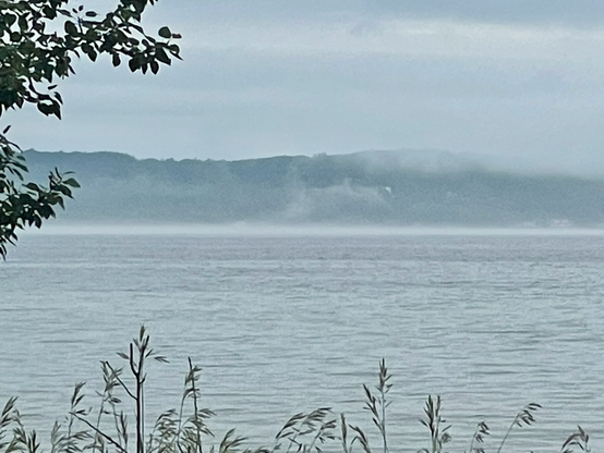 Bay view of mist rising from the lake. 