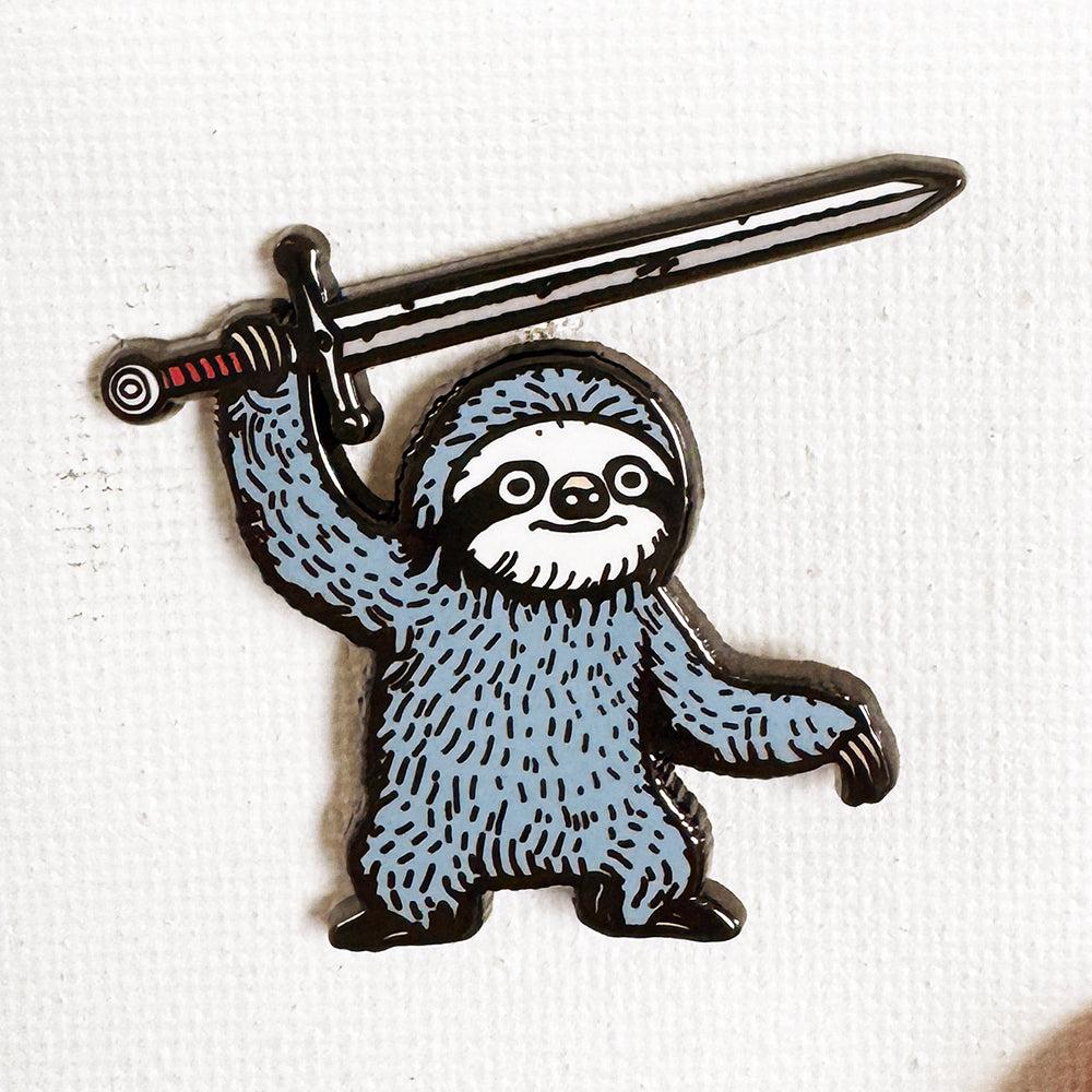 A pin of a sloth holding a sword over its head. A pin of a sloth holding a sword over its head.
