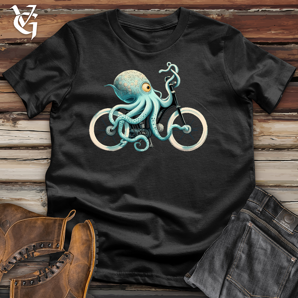 A Black tshirt with an octopus riding a bike on it.