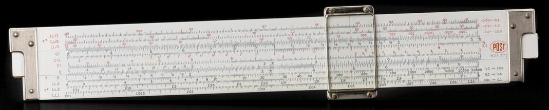 Image of a white slide rule with black lines and digits, on a black background.