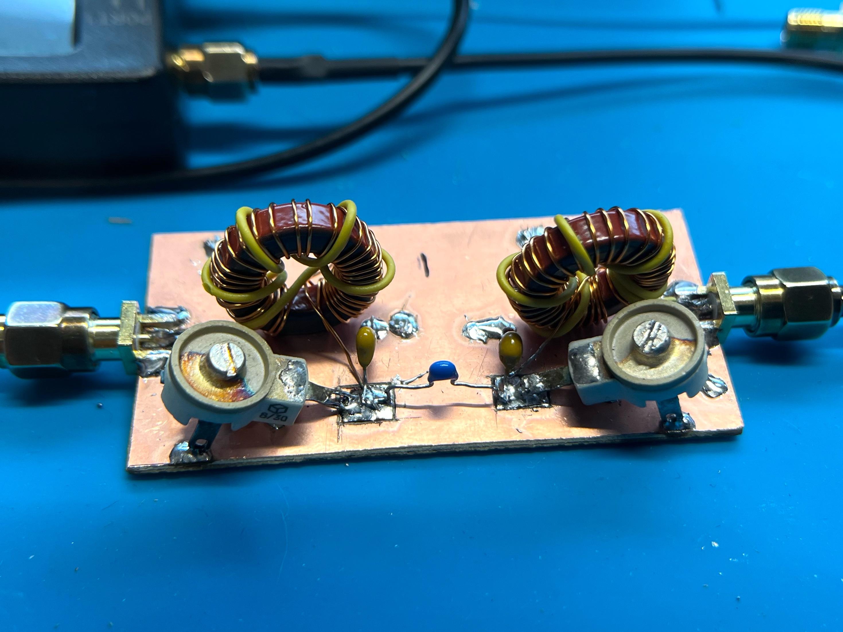 40m band pass filter on copper clad board, using T68-2 toroids and Soviet trimmer capacitors.