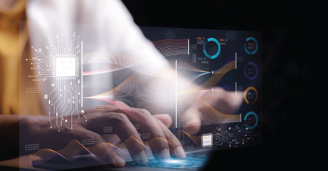 A photo illustration of a person typing with futuristic overlay of graphs.