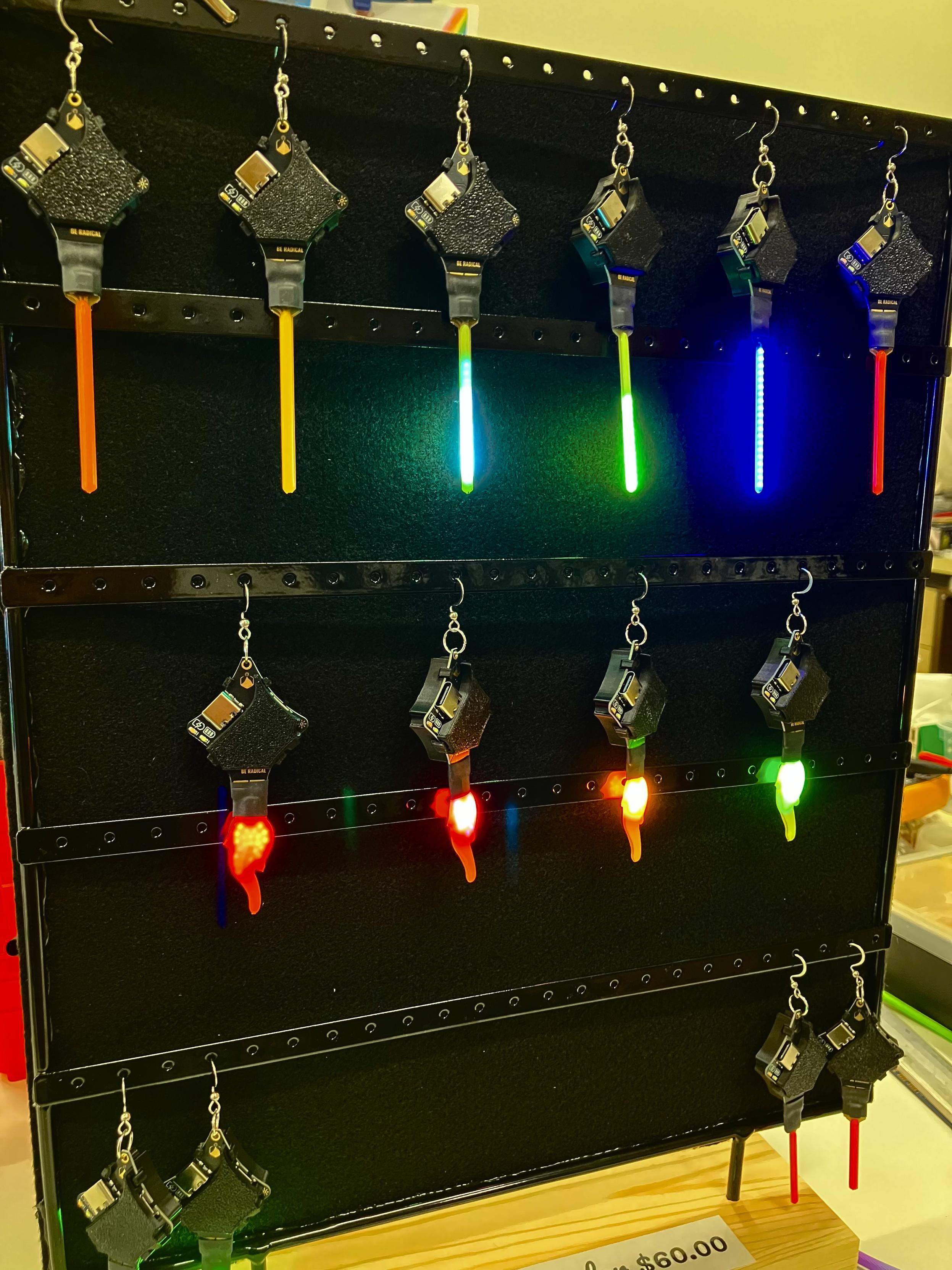 A static image of the animated Glowies, there are four flames on the bottom row and six shooting stars/sabers on the top row only a few are illuminated.