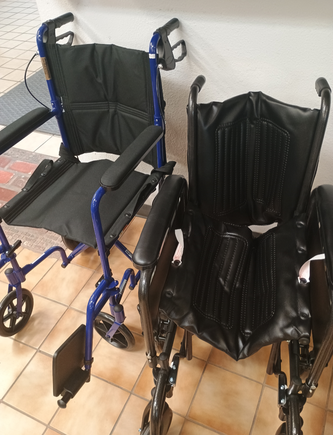 The blue chair next to black foldable one like Dez has now that's falling apart. (Wasn't labeled with. Price but prob around 300)
