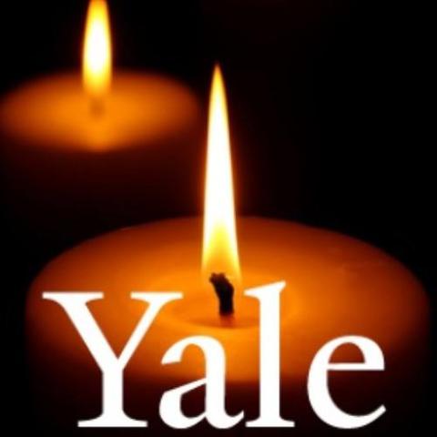 Logo of a candle with the word Yale