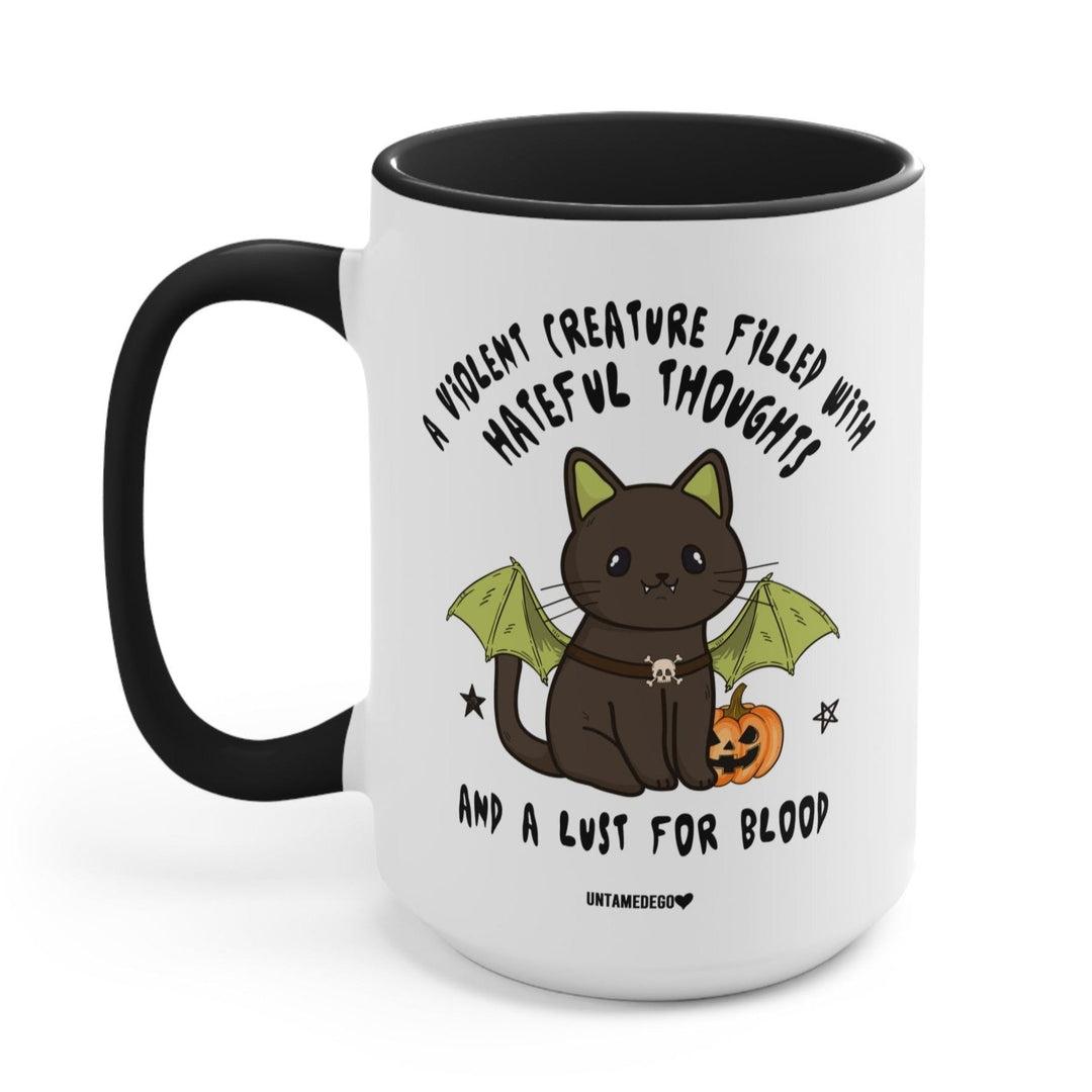 A white mug with a black cat wearing bat wings and ears. It says "a violent creature filled with hateful thoughts and a lust for blood".