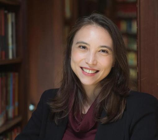 A woman smiling at the camera.