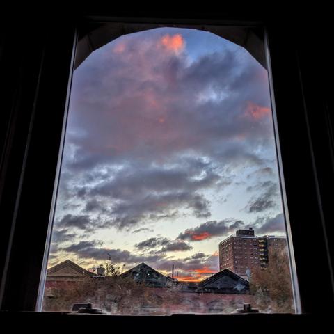 Good morning from Harlem


#Photography #GoodMorning #Sunrise #NYC #Windows​ #GoodMorningFromHarlem


Looking through an arched window ninety minutes after sunrise the blue sky is filled with a swirling tapestry of white clouds. Pointed roofs of Harlem brownstones are silhouetted across the street, and a taller apartment building can be seen in the distance. The green tops of two trees are on the bottom and right. The window is grimy on the bottom.

