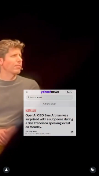 Video still of Sam Altman sitting on a stage with a look of constipated self importance and victimhood. In this frame, you can't see the guy holding the subpoena, but Sam does. Sam does.
